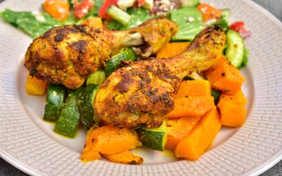 Kycklingben med pumpa och zucchini i ugnen